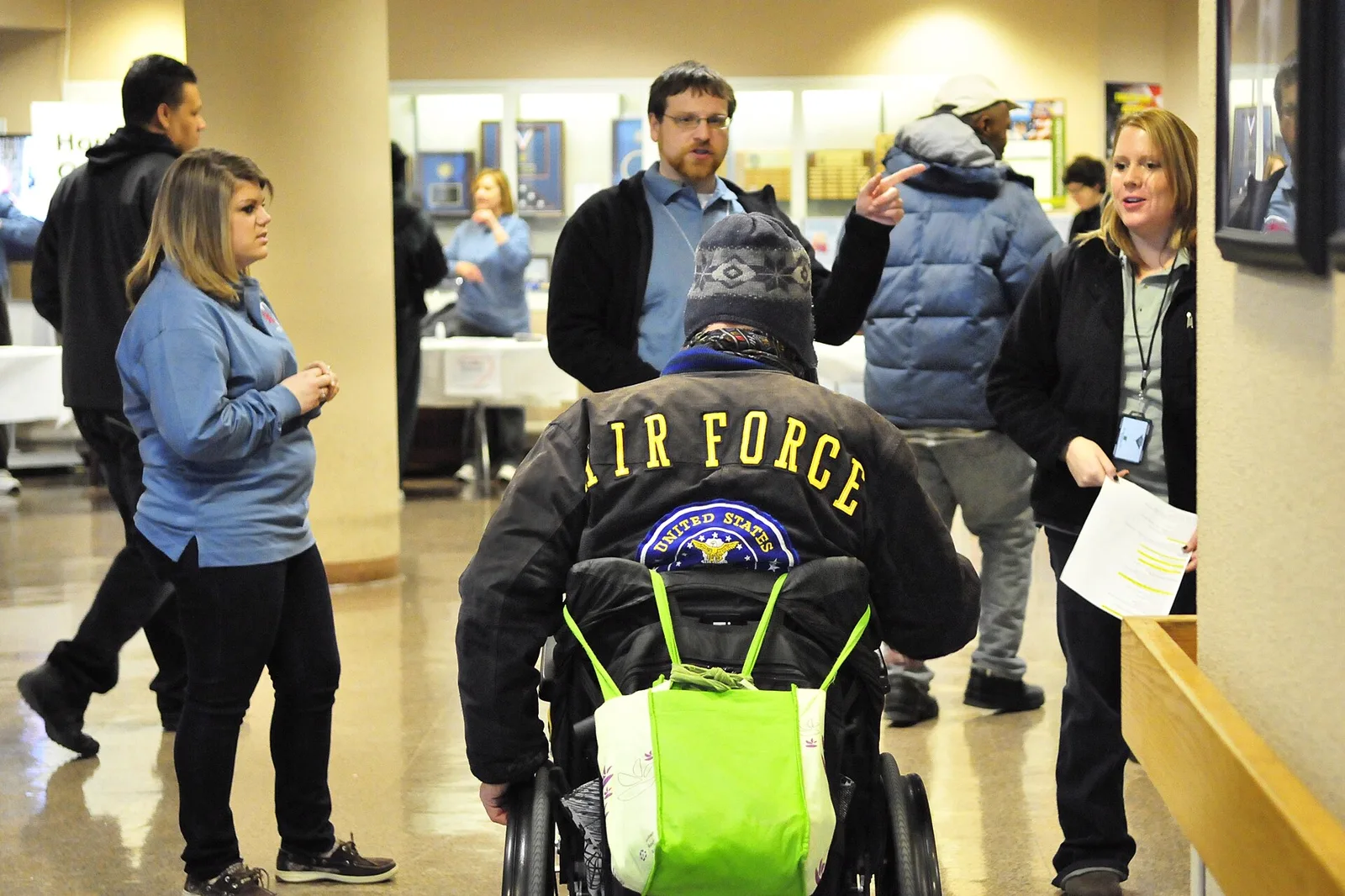 Outreach workers welcoming people at a community shelter services event