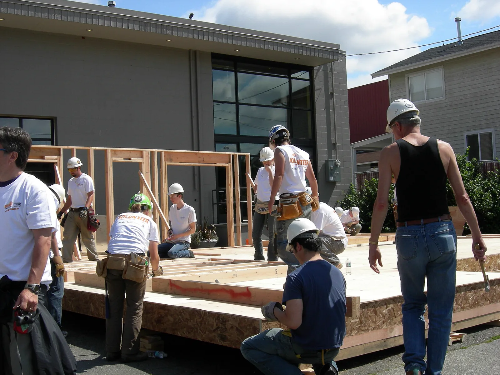 Volunteers framing a house at an affordable housing build