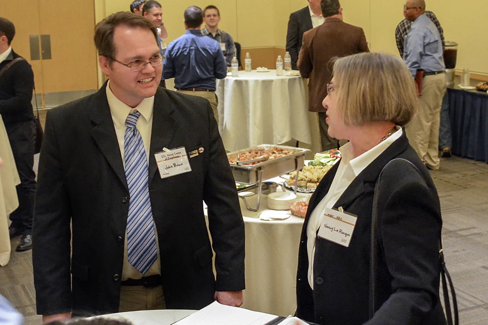 A veteran meeting with support services staff at a job fair