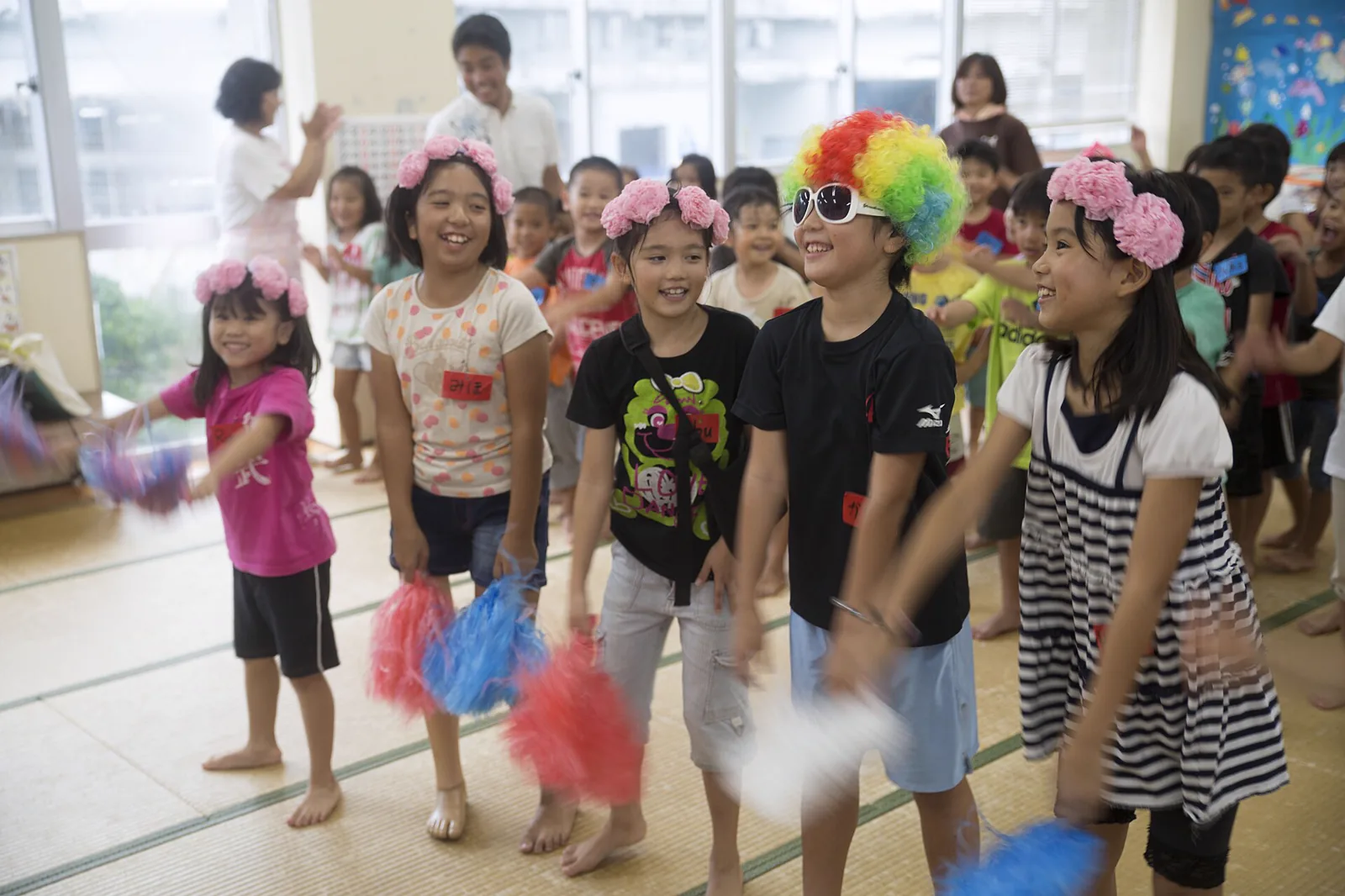 Children singing and playing together at a community program